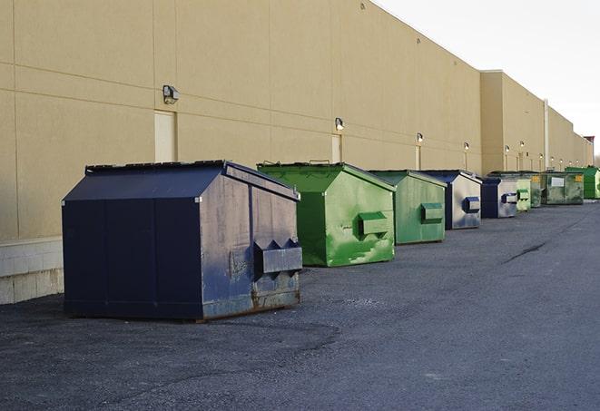 construction dumpsters on a worksite surrounded by caution tape in Auburn Hills